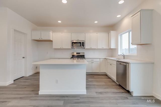 6847 W Riverwood St, Boise, ID 83709 - kitchen featuring white cabinets, stainless steel appliances, light countertops, and recessed lighting
