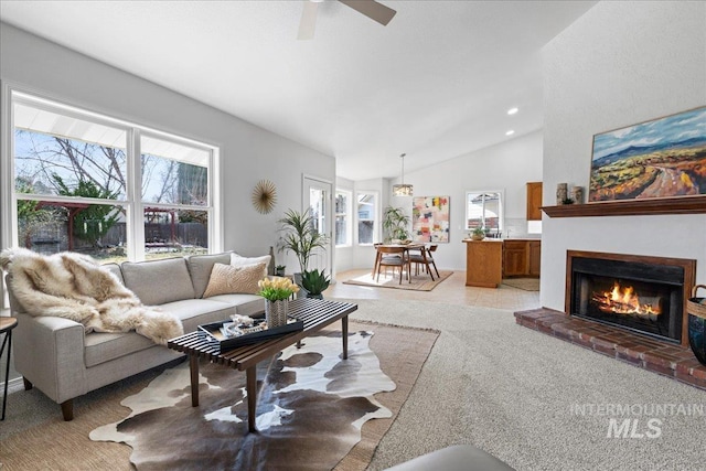 living area with ceiling fan, recessed lighting, light colored carpet, a fireplace, and vaulted ceiling