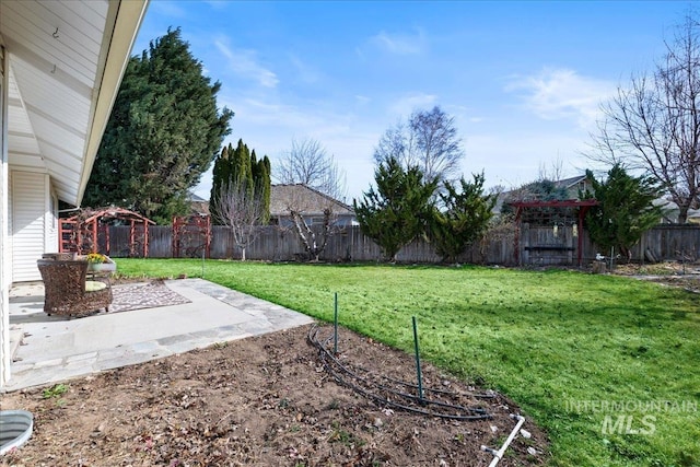 view of yard featuring a patio area and a fenced backyard