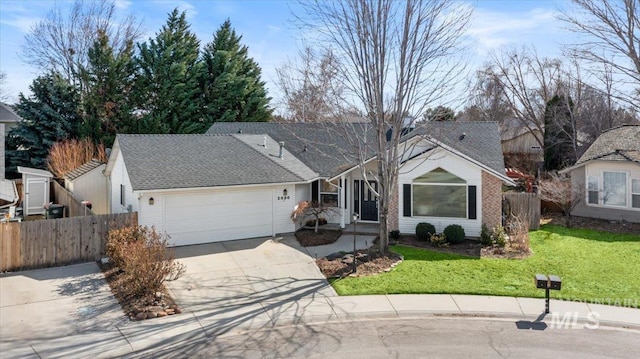 ranch-style house with roof with shingles, concrete driveway, fence, a garage, and a front lawn