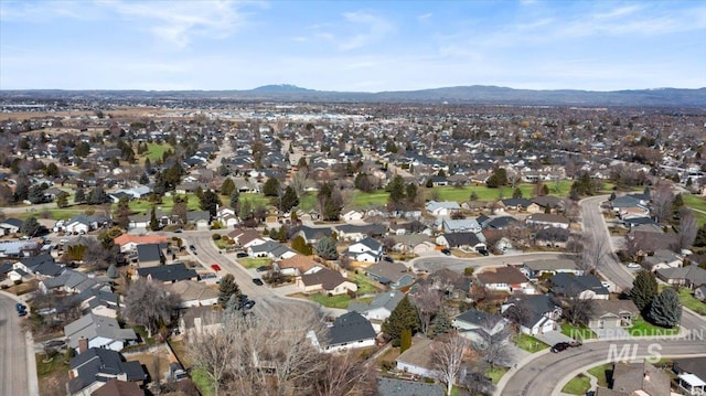 drone / aerial view featuring a residential view and a mountain view