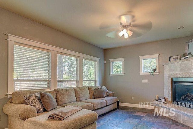 1878 W Sheep Hill Ct, Meridian, ID 83646 - living area featuring a ceiling fan and a fireplace
