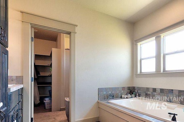 1878 W Sheep Hill Ct, Meridian, ID 83646 - bathroom featuring a garden tub and vanity