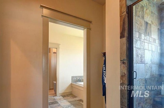 1878 W Sheep Hill Ct, Meridian, ID 83646 - bathroom with a garden tub, a stall shower, and stone finish flooring