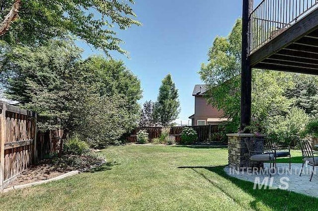 1878 W Sheep Hill Ct, Meridian, ID 83646 - fenced backyard with a patio area
