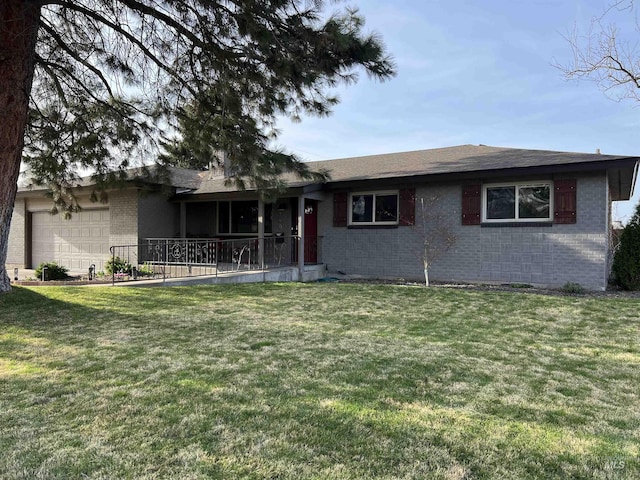 ranch-style home featuring brick siding, a front yard, and an attached garage