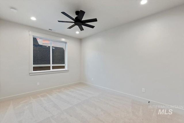unfurnished room featuring recessed lighting, baseboards, light carpet, a ceiling fan, and a smoke detector