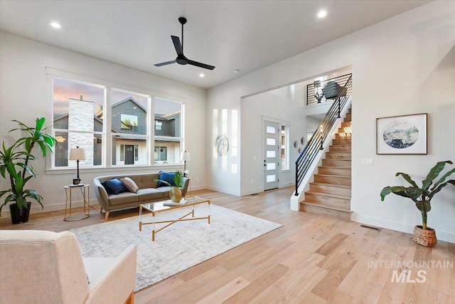 living room featuring a ceiling fan, healthy amount of natural light, baseboards, and recessed lighting