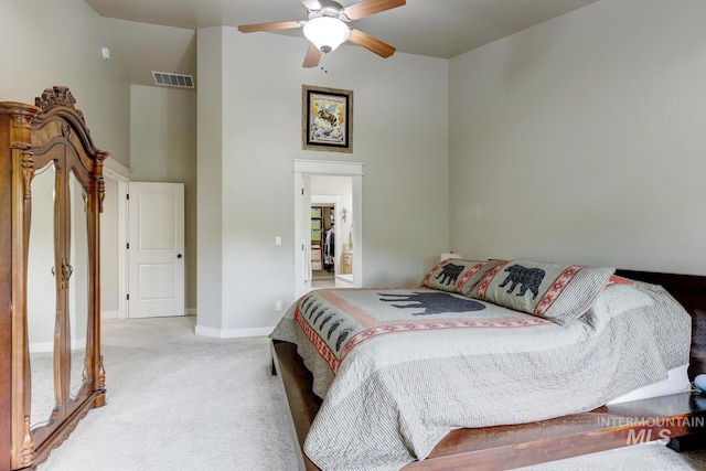 12507 N Humphreys Way, Boise, ID 83714 - bedroom featuring light colored carpet, a towering ceiling, baseboards, and a ceiling fan