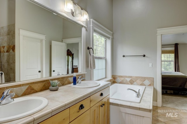 12507 N Humphreys Way, Boise, ID 83714 - full bathroom featuring connected bathroom, a bath, double vanity, healthy amount of natural light, and a high ceiling