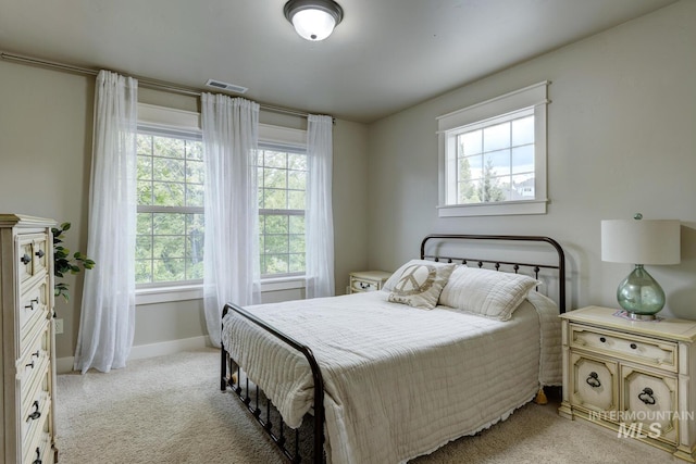 12507 N Humphreys Way, Boise, ID 83714 - bedroom with multiple windows, baseboards, and light colored carpet