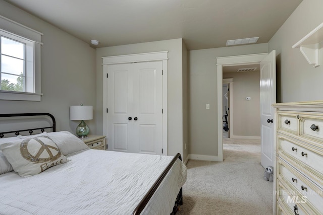 12507 N Humphreys Way, Boise, ID 83714 - bedroom with light carpet, a closet, and baseboards