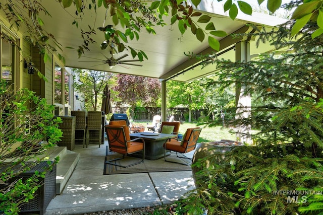 12507 N Humphreys Way, Boise, ID 83714 - fenced backyard with an outdoor fire pit, ceiling fan, and a patio area