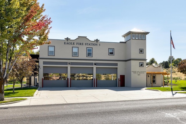 12507 N Humphreys Way, Boise, ID 83714 - view of front of property with stucco siding, concrete driveway, and a garage