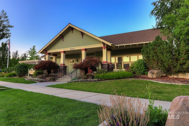 12507 N Humphreys Way, Boise, ID 83714 - craftsman-style home with a front lawn, covered porch, and a shingled roof
