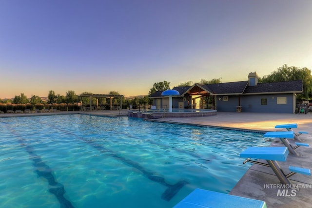 12507 N Humphreys Way, Boise, ID 83714 - pool at dusk with a community pool, a community hot tub, and a patio