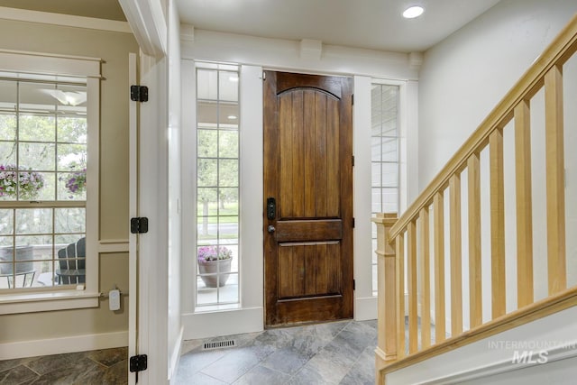 12507 N Humphreys Way, Boise, ID 83714 - foyer featuring baseboards, stone finish flooring, and stairway