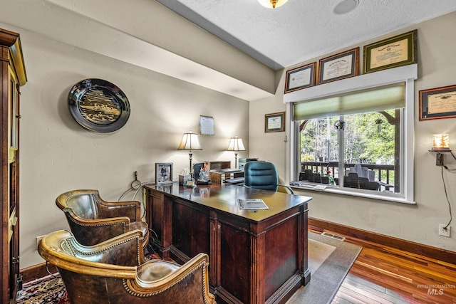 911 Davis, Mccall, ID 83638 - office space with hardwood / wood-style flooring, baseboards, and a textured ceiling