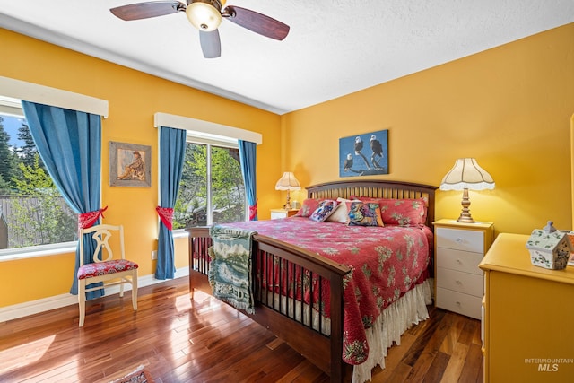 911 Davis, Mccall, ID 83638 - bedroom with wood-type flooring, baseboards, and a ceiling fan