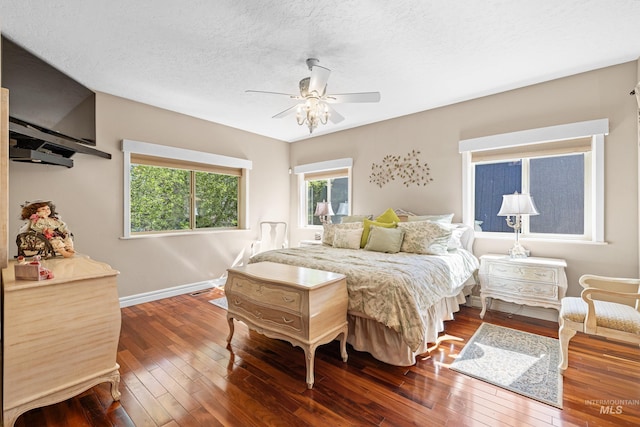 911 Davis, Mccall, ID 83638 - bedroom featuring hardwood / wood-style flooring, baseboards, ceiling fan, and a textured ceiling
