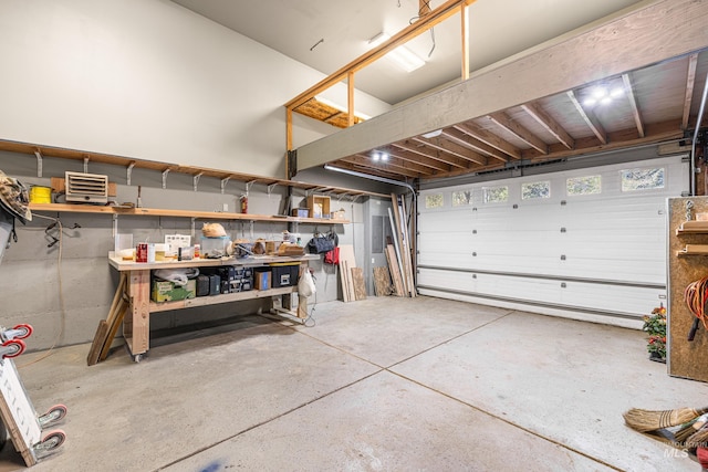 911 Davis, Mccall, ID 83638 - garage featuring electric panel and a workshop area