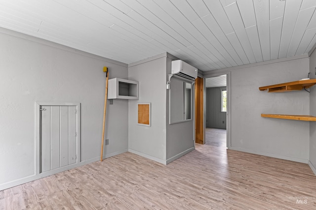 911 Davis, Mccall, ID 83638 - unfurnished room featuring a wall unit AC, wood finished floors, wood ceiling, and baseboards