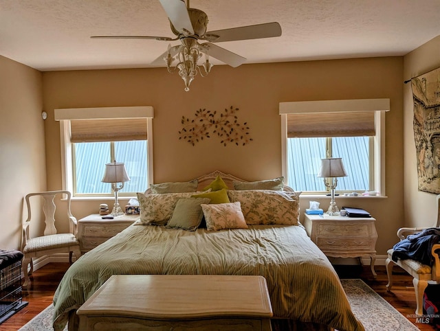 911 Davis, Mccall, ID 83638 - bedroom with wood finished floors, a ceiling fan, and baseboards