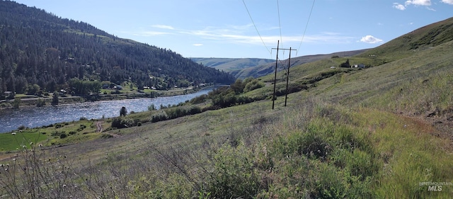 view of mountain feature featuring a water view