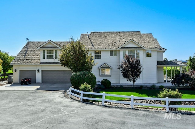 8344 Partridge Dr, Nampa, ID 83686 - view of front facade with fence, an attached garage, and concrete driveway
