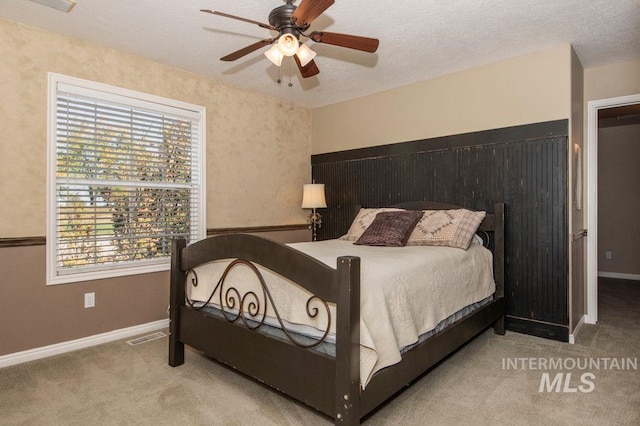 8344 Partridge Dr, Nampa, ID 83686 - carpeted bedroom featuring a textured ceiling, visible vents, baseboards, and multiple windows