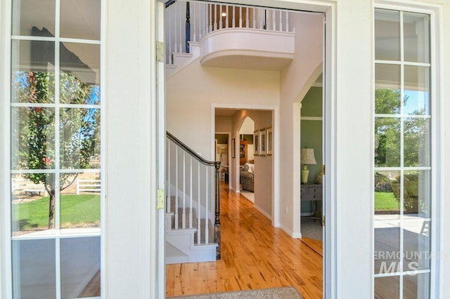 8344 Partridge Dr, Nampa, ID 83686 - entryway with wood finished floors, a healthy amount of sunlight, baseboards, and stairway