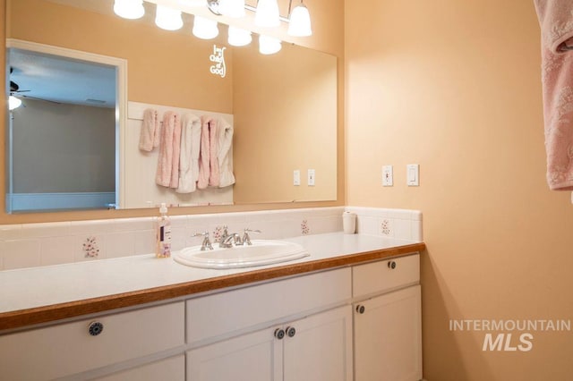 8344 Partridge Dr, Nampa, ID 83686 - bathroom featuring vanity and decorative backsplash