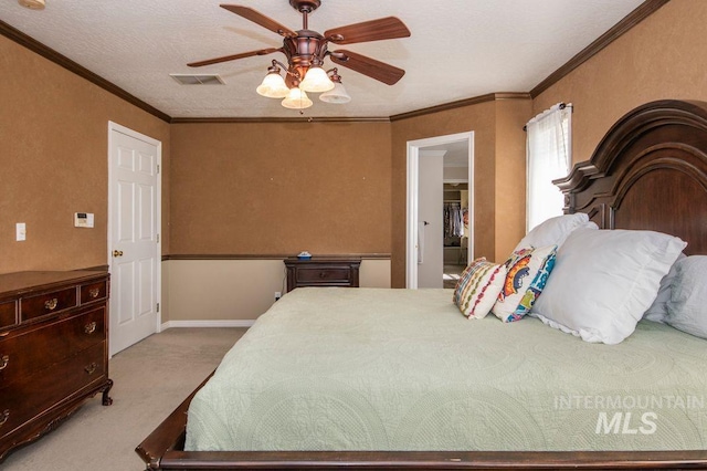 8344 Partridge Dr, Nampa, ID 83686 - bedroom with a spacious closet, visible vents, ornamental molding, light colored carpet, and ceiling fan