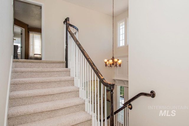 8344 Partridge Dr, Nampa, ID 83686 - stairway featuring an inviting chandelier