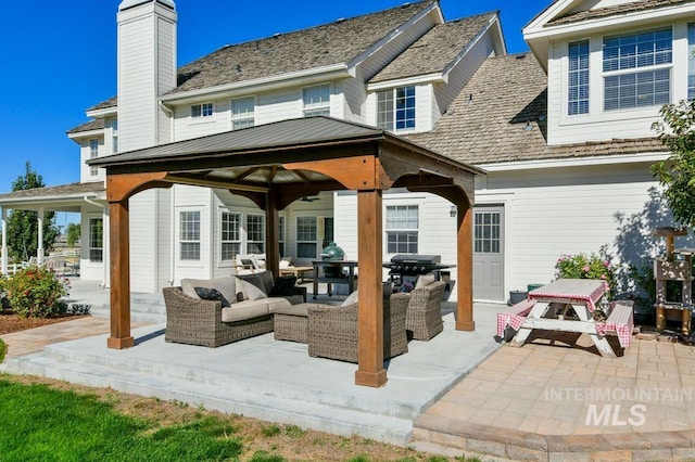 8344 Partridge Dr, Nampa, ID 83686 - rear view of property with a gazebo, an outdoor hangout area, a chimney, and a patio