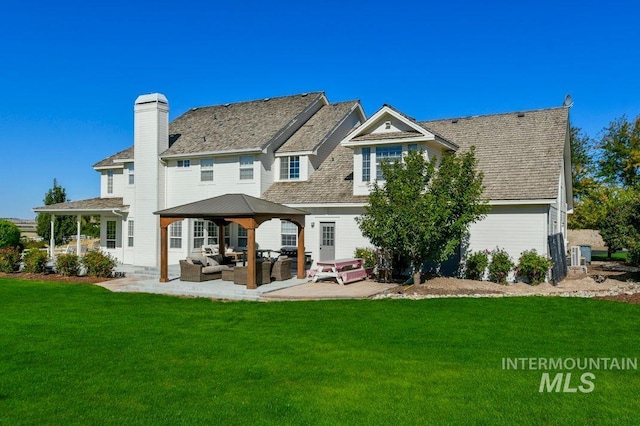 8344 Partridge Dr, Nampa, ID 83686 - rear view of house with a yard, an outdoor hangout area, a patio area, and a gazebo