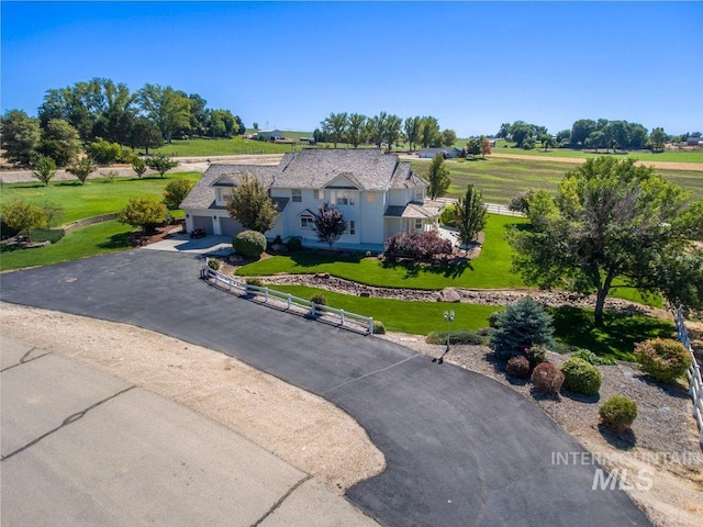 8344 Partridge Dr, Nampa, ID 83686 - exterior space with fence, an attached garage, driveway, and a front yard