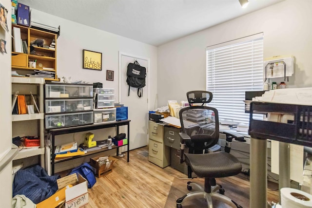 home office with wood finished floors