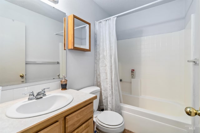 bathroom with vanity, toilet, and shower / bath combo with shower curtain