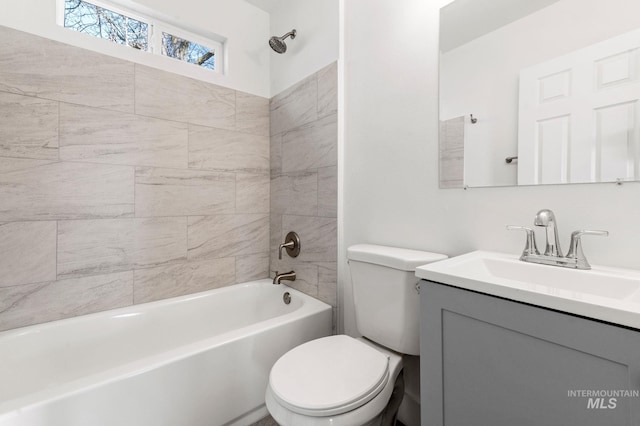 bathroom with shower / bath combination, vanity, and toilet