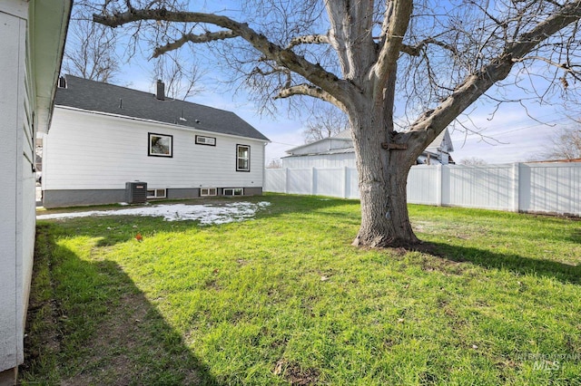 view of yard featuring a fenced backyard and central air condition unit