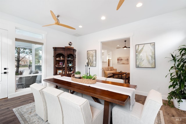 dining area featuring dark wood finished floors and a ceiling fan