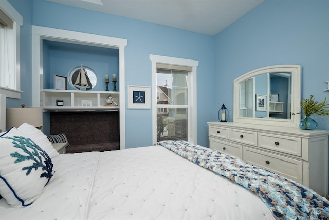 bedroom featuring multiple windows