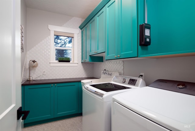 laundry area with cabinet space and washer and clothes dryer