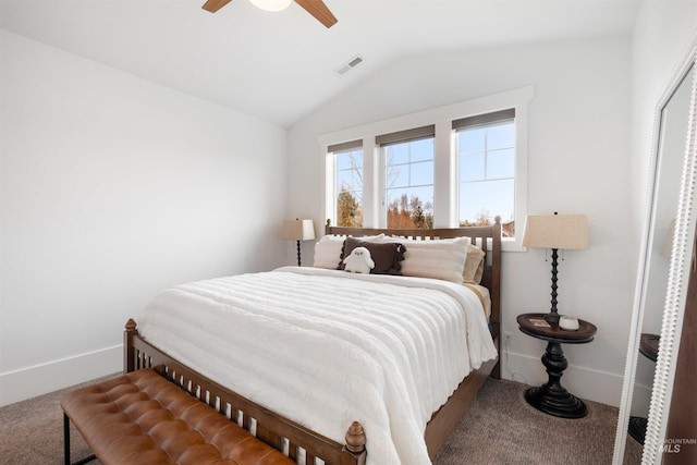 carpeted bedroom featuring lofted ceiling, ceiling fan, visible vents, and baseboards