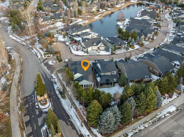 bird's eye view featuring a water view and a residential view