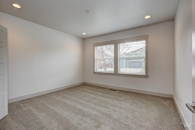 unfurnished room with carpet floors