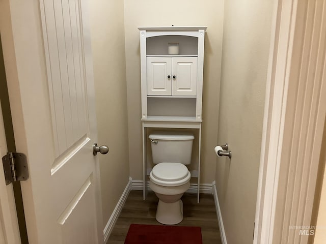 11565 W Zachery Ave, Nampa, ID 83651 - bathroom featuring wood finished floors, baseboards, and toilet