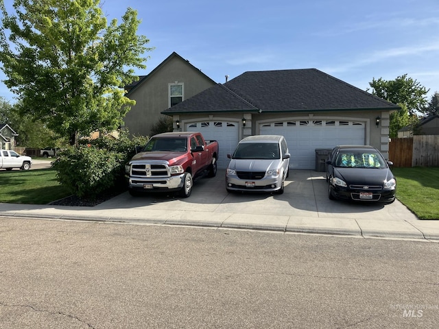 11565 W Zachery Ave, Nampa, ID 83651 - traditional-style home featuring a garage, concrete driveway, and fence