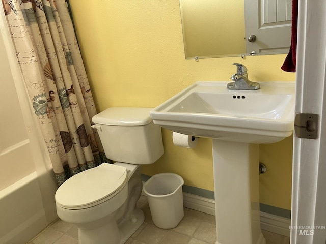 11565 W Zachery Ave, Nampa, ID 83651 - bathroom featuring tile patterned flooring, toilet, and shower / bath combo